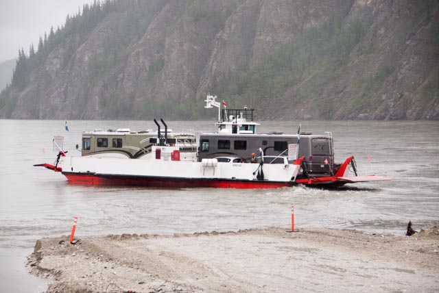 Motorhomes being ferried from Dawson City across the Yukon River to Top of the World Highway