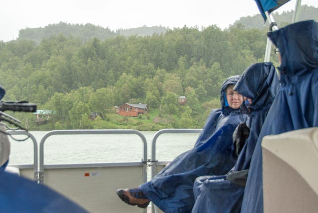 Marilyn, along with her wet companions, is looking forward to our pontoon boat arriving at the lodge for a warm, dry room with warm, wet beverages.