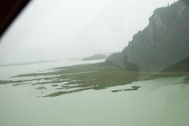 Muskeg extends from the shore next to the mountain well into the lake. It's difficult to distinguish the muskeg from "real" ground.