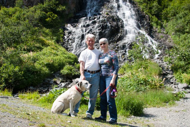 Dave, Marilyn, and Beighley pose in front of one of the beautiful waterfalls near Valdez, AK.